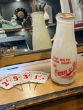 Old shop display milk bottle