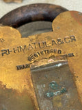 Close-up of Rahmatulla & Co registered trade mark stamp on padlock