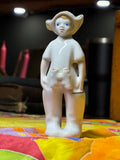 Mid-century Soviet figurine of boy in Budenovka hat