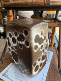Full view of brown and cream crater glaze vase by Strehla