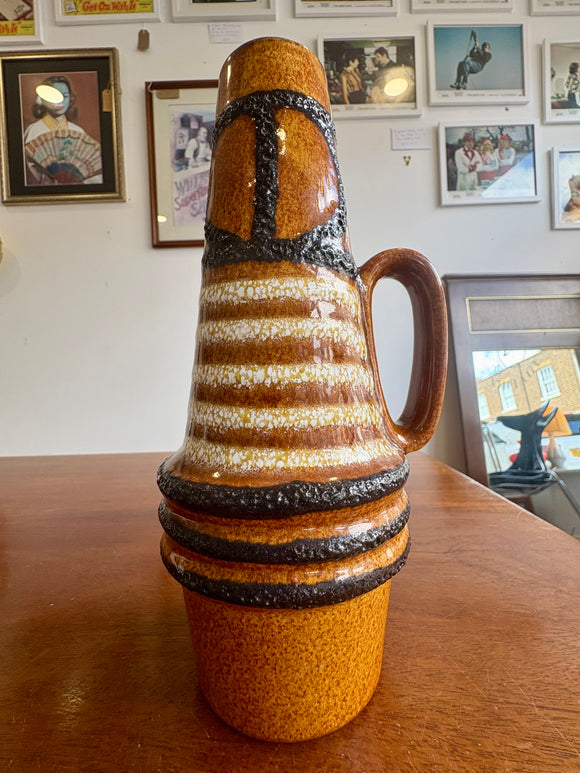 Mid-century Scheurich West German pottery jug vase with brown glaze, cream stripes and black textured bands. 