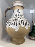 Mid-century West German pottery vase with black and white lava glaze decorative patterns on a ochre background