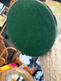 Underside of the ebonised base of a Philip's table globe, fitted with green baize
