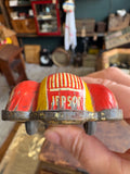 Rear end view of vintage JBP 501 tinplate racing car showing JEPSON name and striped tail detail