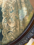 Detail of the lower right section of the Queen Victoria portrait showing the intricate lace mantle with scrolling floral and botanical pattern, and the lower section of the carved mahogany frame with beaded inner moulding.