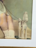 Close-up of child’s legs and wooden rocking horse toy in the photograph
