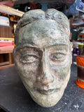 Mid-century plaster maquette head of a woman, front view