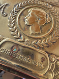 Close-up detail of Christmas 1914 lettering and laurel wreath