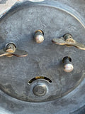 Close-up of clock back plate showing winding knobs and “Made in China” marking