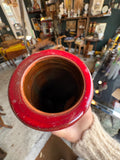 Top view of red drip glaze vase showing rim and interior glaze