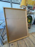 Reverse of framed Soviet Navy propaganda poster showing MDF backing board with hanging wire and plain wood frame profile