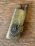 Back of 1932 brass Soviet lighter with engraved date and markings