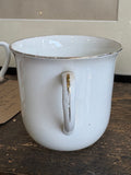 Handle of WWI commemorative mug showing gilt wear