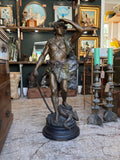 Detailed spelter statue of hunter with bow and game bird