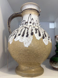 Mid-century West German pottery vase with black and white lava glaze decorative patterns on a ochre background