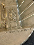 Close-up of Arc de Triomphe relief and Albert-Herbemont signature on medallion reverse