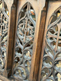 Detail of a carved quatrefoil motif on the side panel of an antique Gothic Revival oak lectern