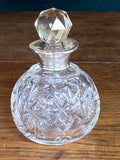 Cut glass scent bottle with silver collar