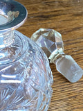 Cut glass scent bottle with silver collar