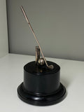 Vintage chrome Polo trophy on a bakelite base