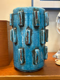 	Turquoise sculptural vase with raised blocks in the Scandinavian mid century style, front view