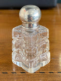 Small Victorian quality pressed glass scent bottle with sterling silver top.